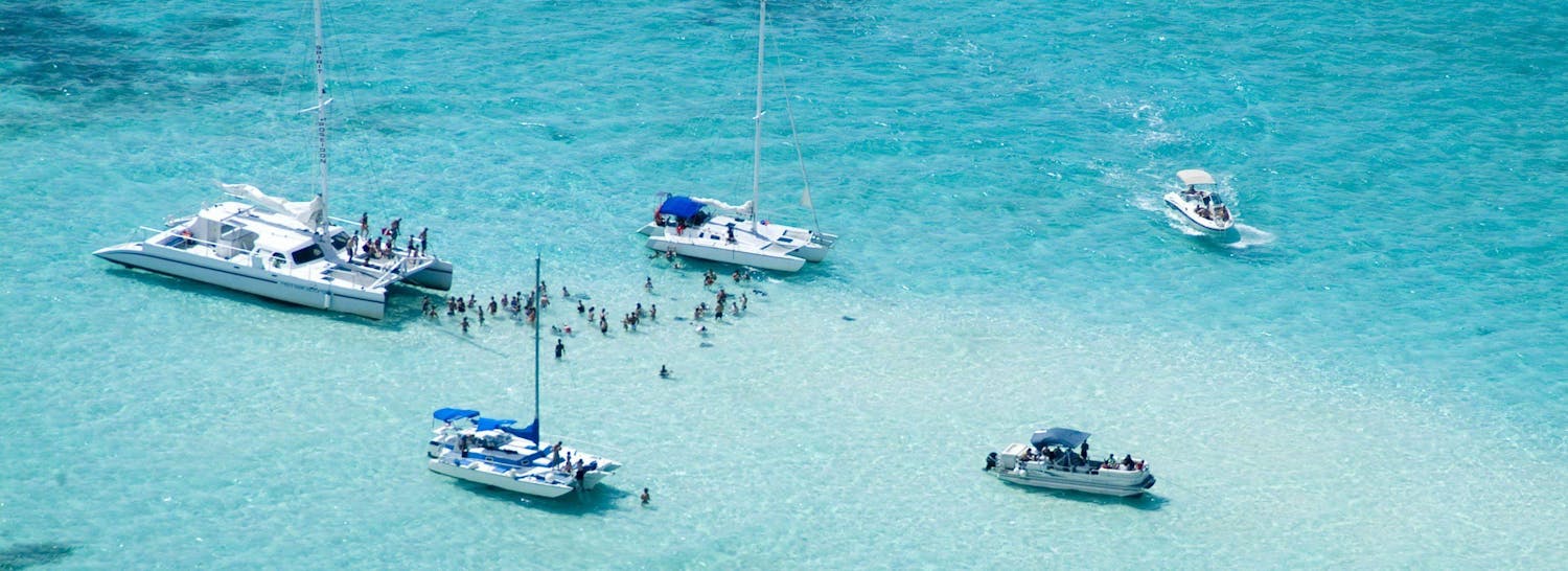 Aerial shot of boats anchored in Stingray City in the Cayman Islands