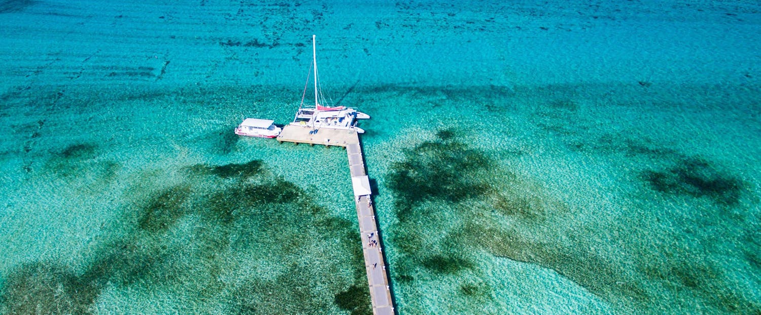 Aerial view of boat docked at a pier in the Cayman Islands