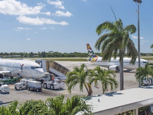 Cayman Airways airplanes parked at Owen Roberts International Airport