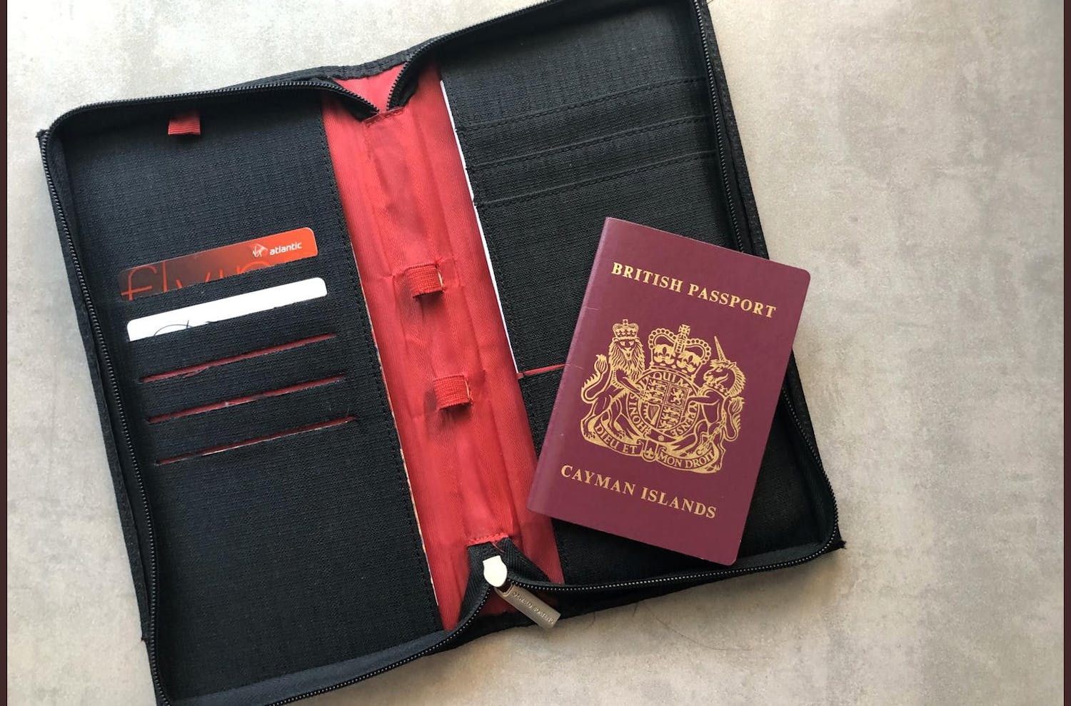 Cayman passport laying open on a passport holder