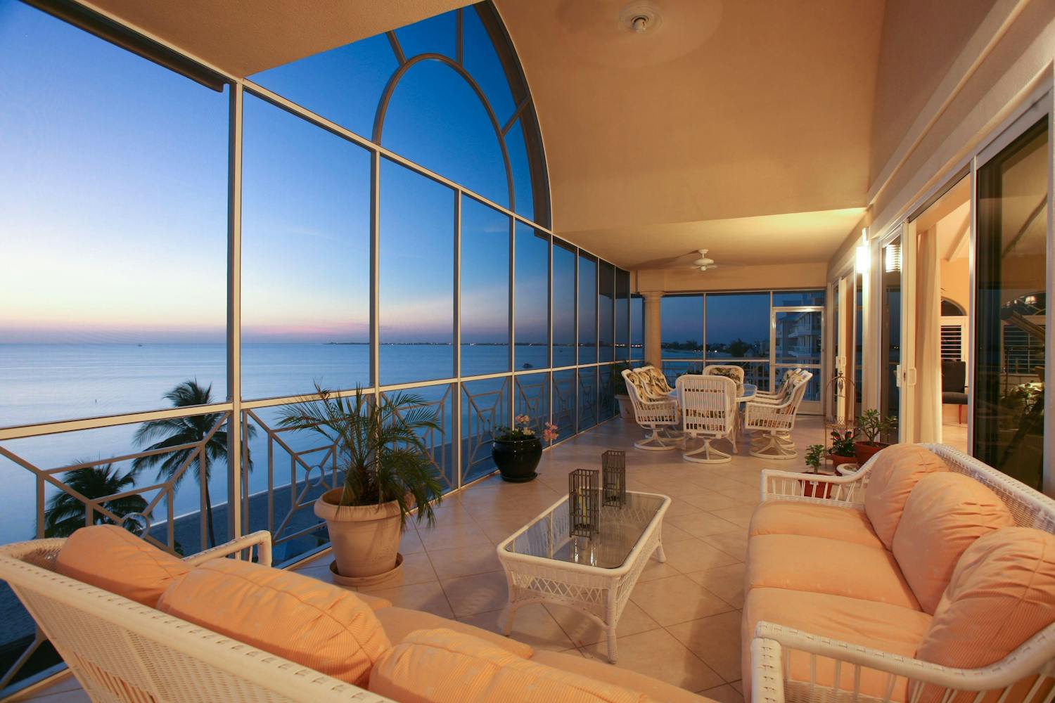 Enclosed patio overlooking the ocean at sunset