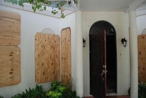 House protected with hurricane shutters