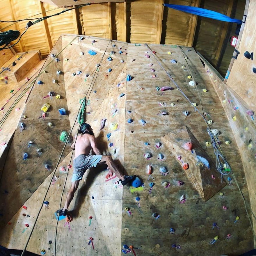 Person indoor rock climbing