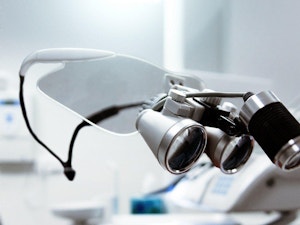 Person showing optometrist magnifying glass