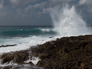 Waves crashing against rocks in the Cayman Islands