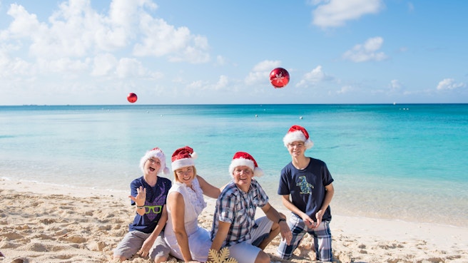 Family enjoying christmas on the beach in cayman