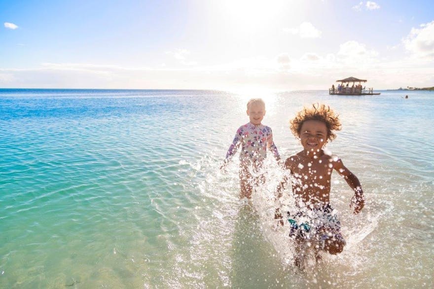 Kids running in the sea