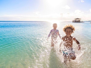 Kids running in the sea