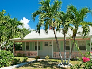 Old cayman style home in light green