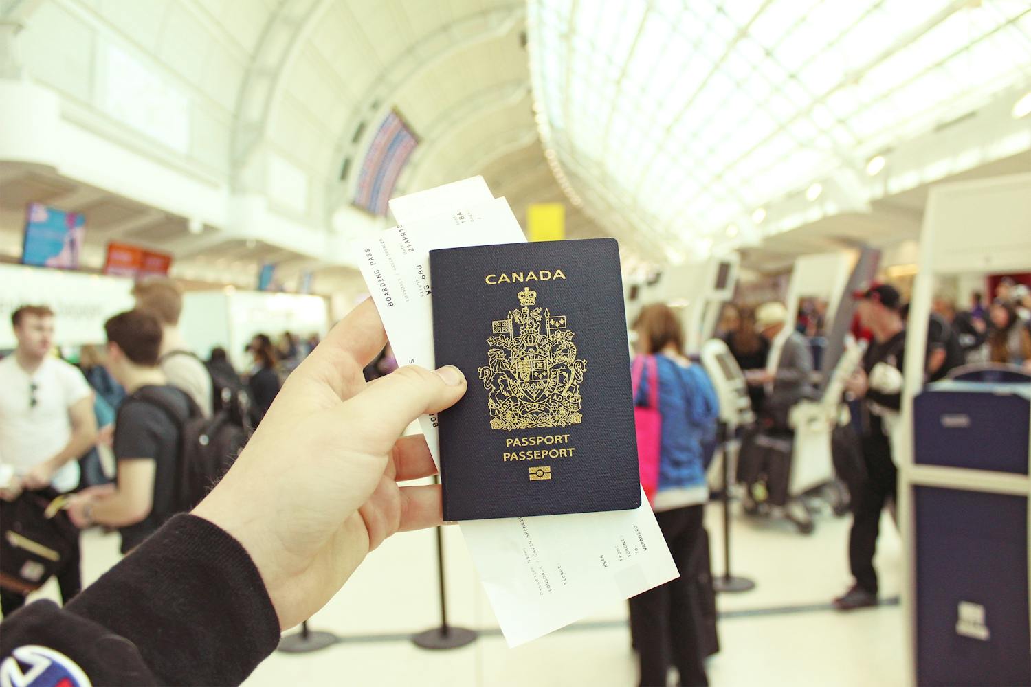 Person holding a canadian passport in airport