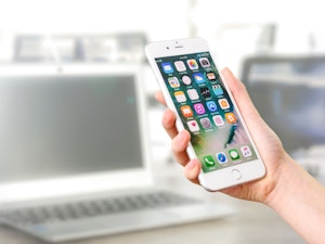 Person holding silver iphone 7