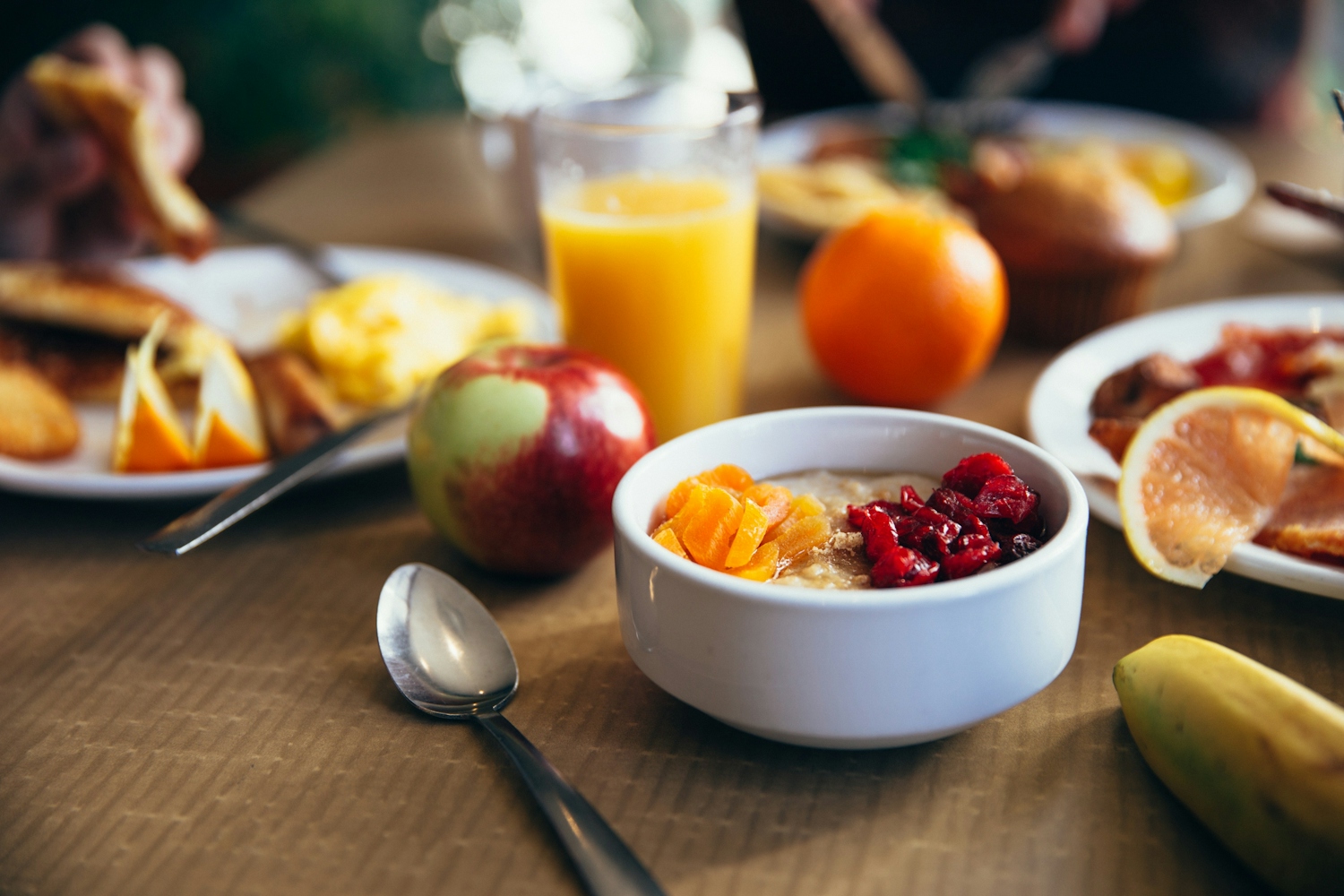 Shallow focus photo of spoon at nutritious healthy breakfast