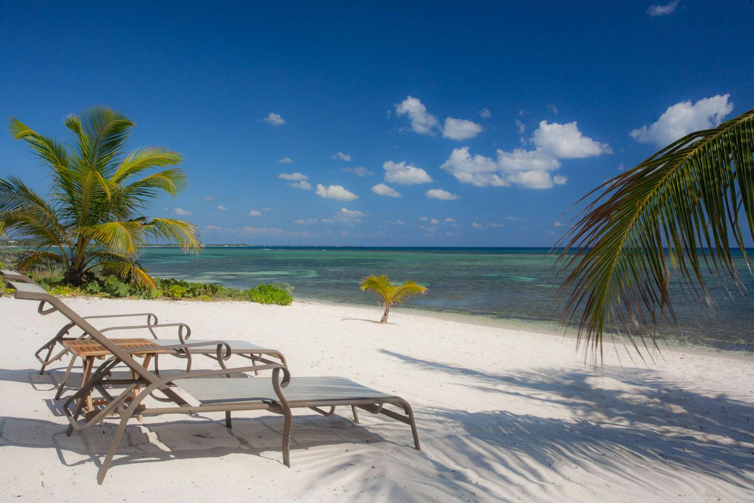 Sun lounger chairs on deserted beach