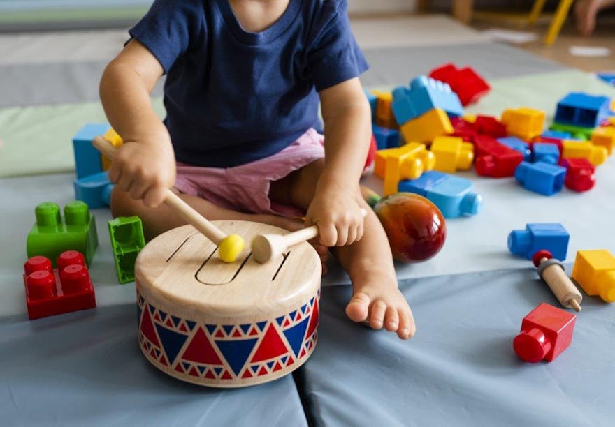 Toddler playing the drum