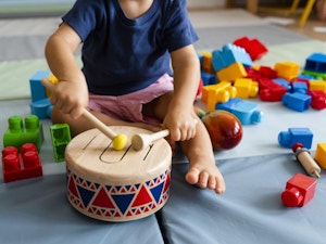 Toddler playing the drum